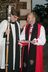 Chatting with his chaplain, the Rev Clifford Skillen, before knocking to gain entry to Christ Church Cathedral.